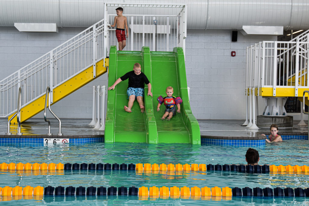 Kids Sliding into pool
