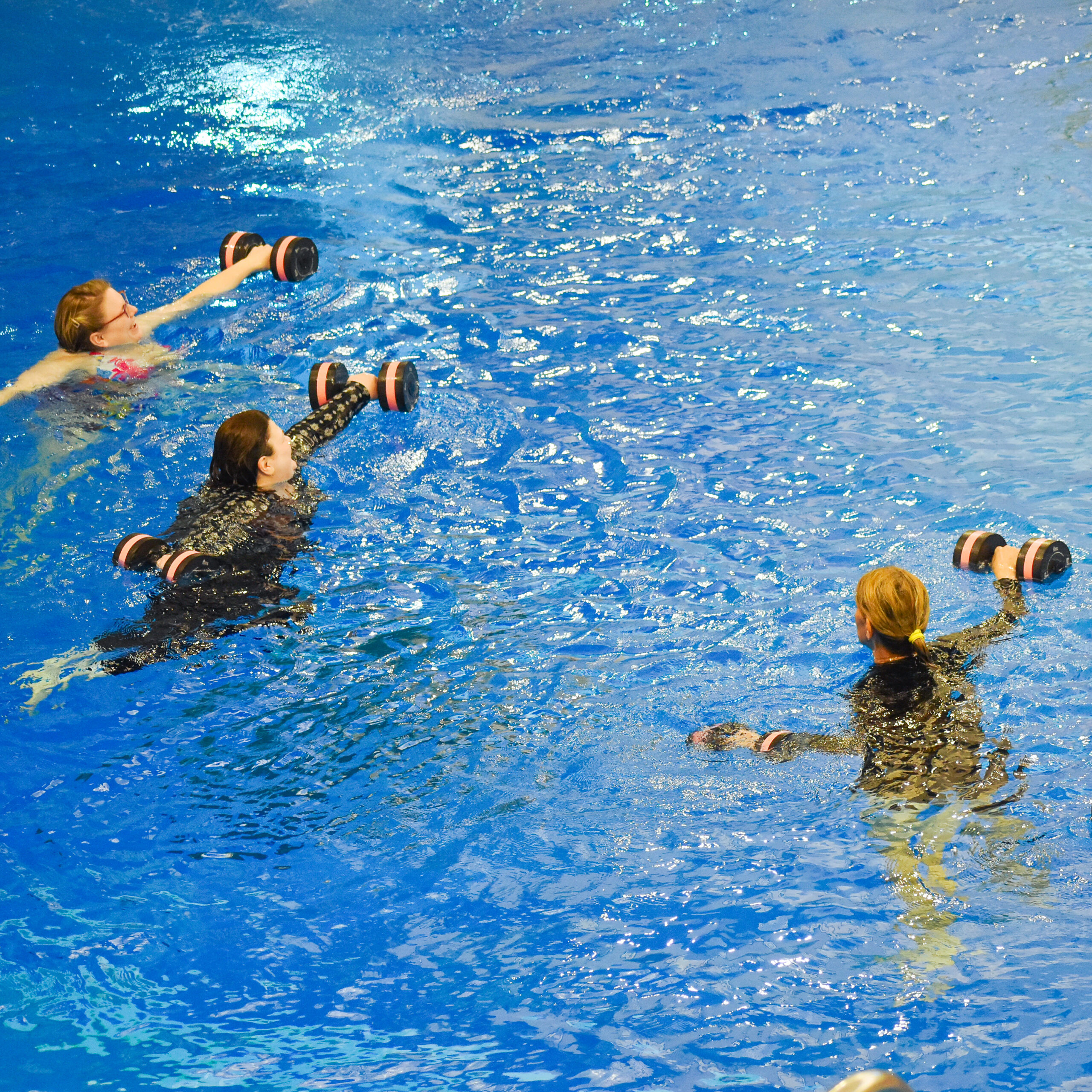 Three Ladies Working Out in Deep Water Aerobics