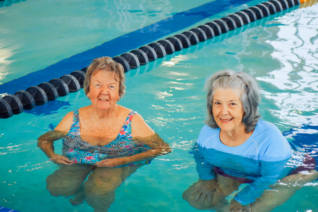 Two Older Ladies Swimming in The Huntington Community Pool at The Aquatic Center at Mylan Park